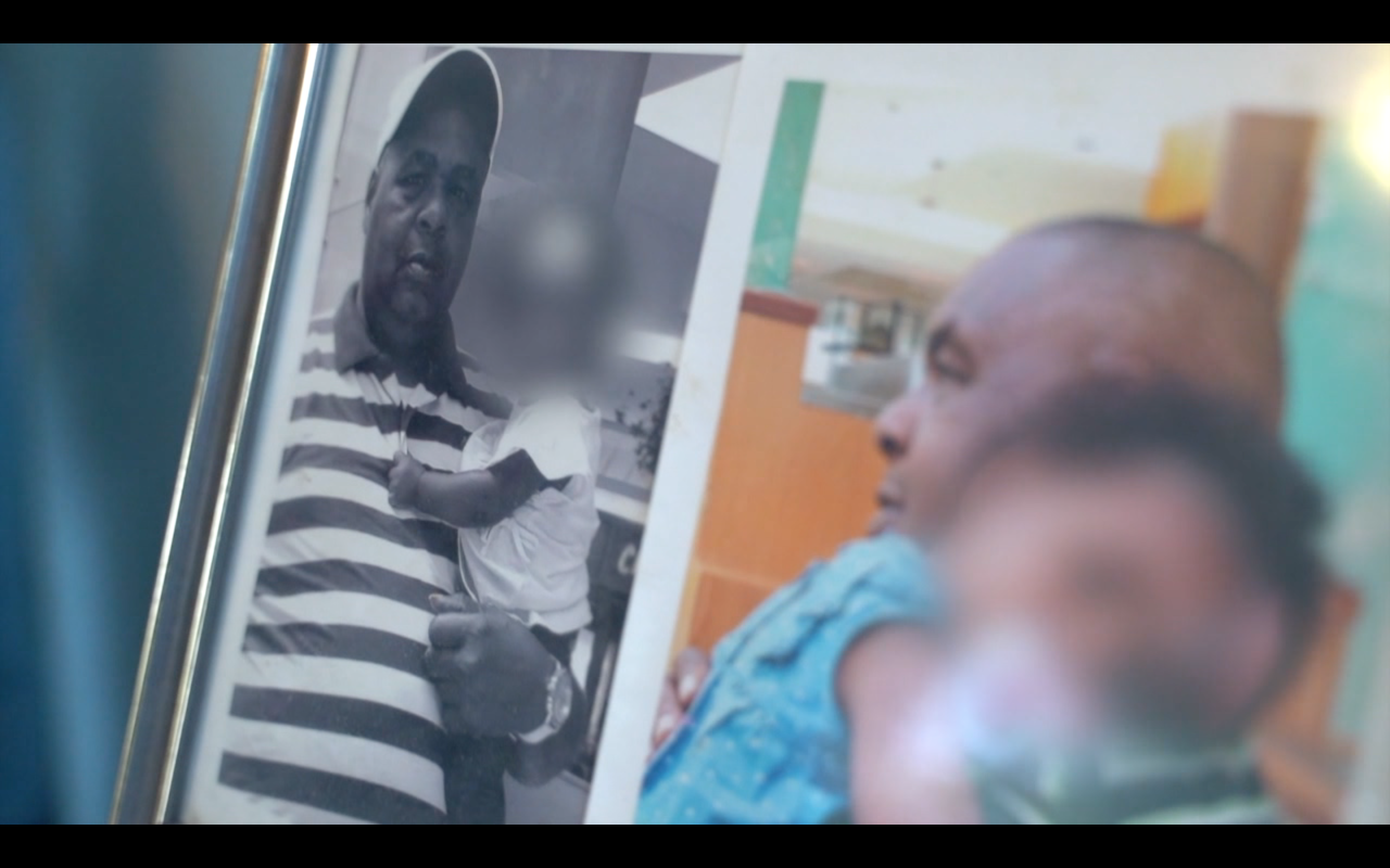 father holding child