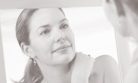 Woman looking in the mirror