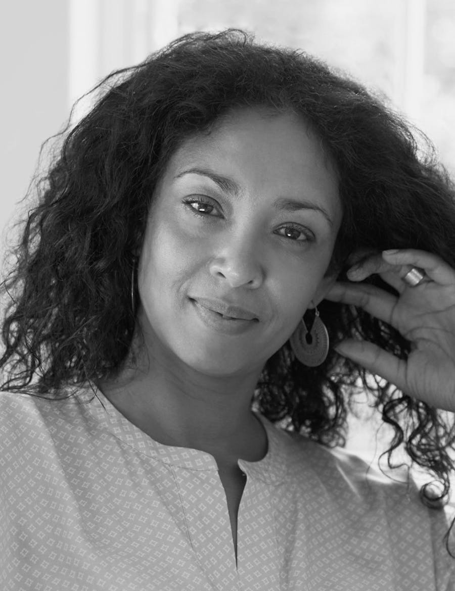 A woman looking directly into the camera.