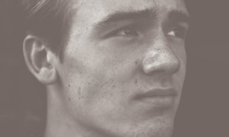 Closeup of a man looking off into the distance.