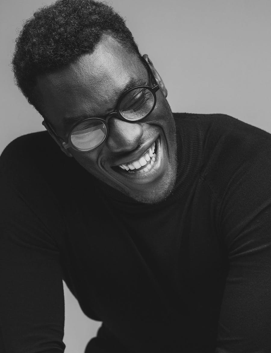 Man with glasses smiling