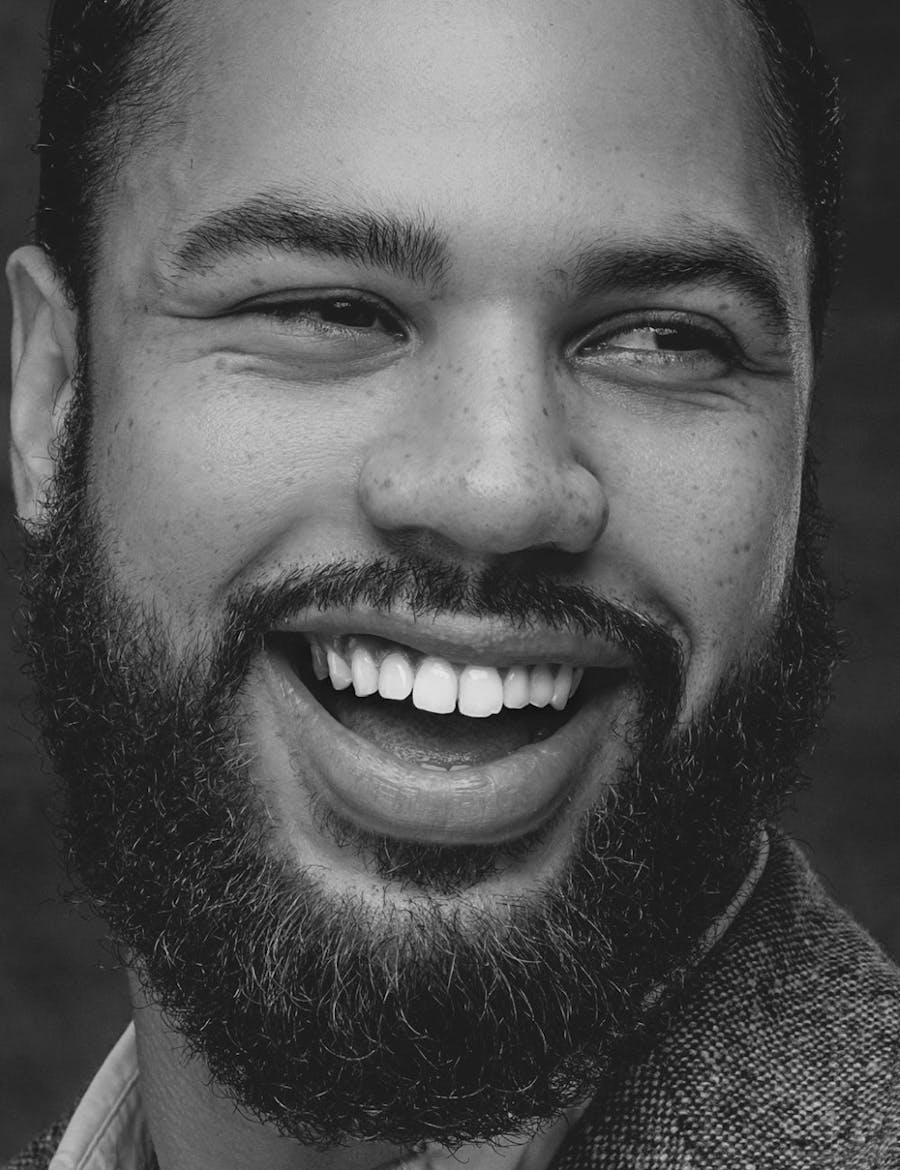 Man with facial hair smiling from his facial contouring in Nashville