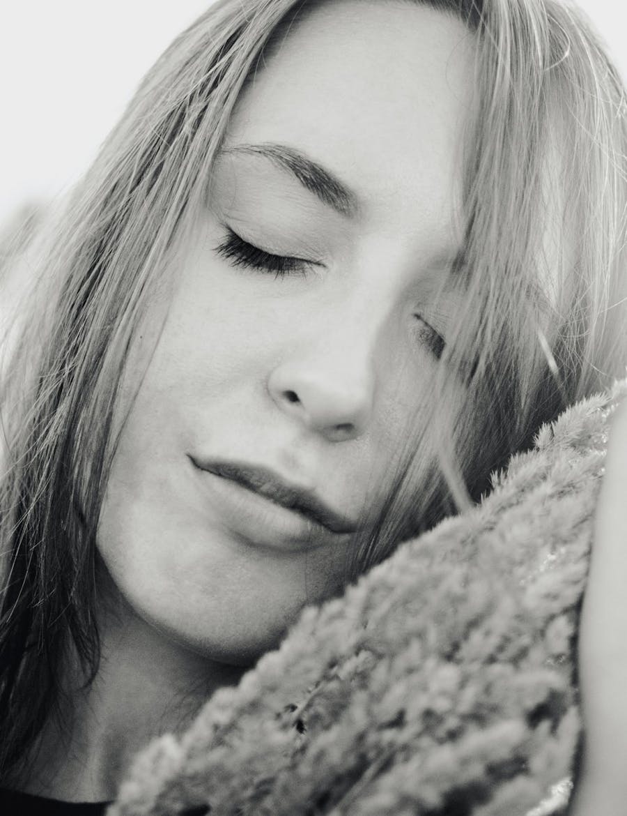 Woman's face with eye's closed.