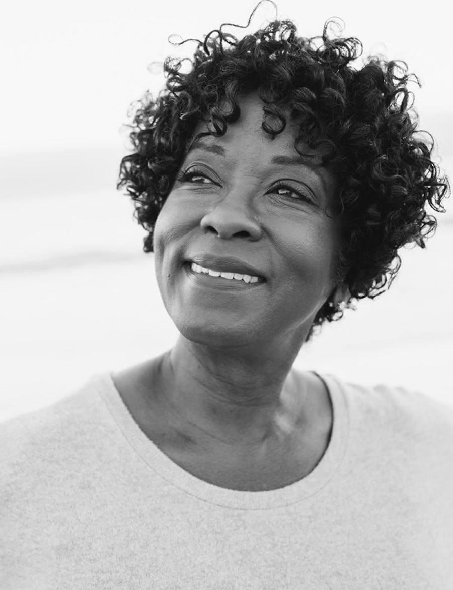 An older woman with curly hair highlighting Botox in Nashville.