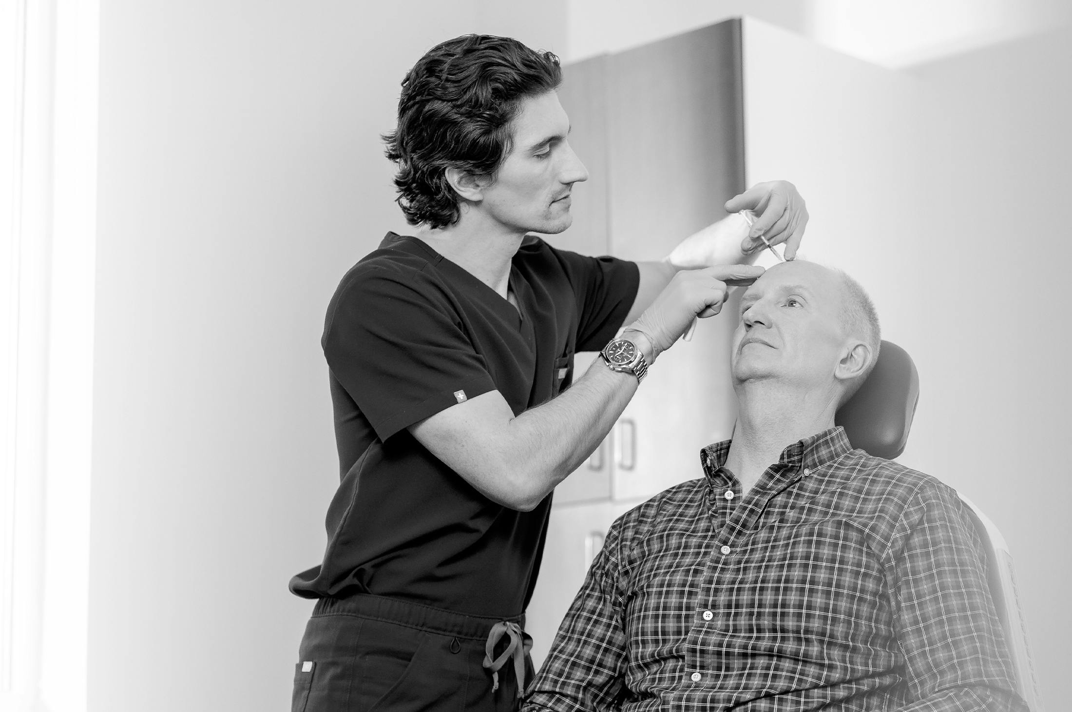 Dr. Bryant adminstering an injection