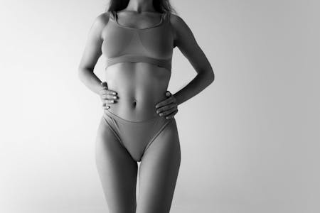 midsection of a woman in a 2 piece undergarment
