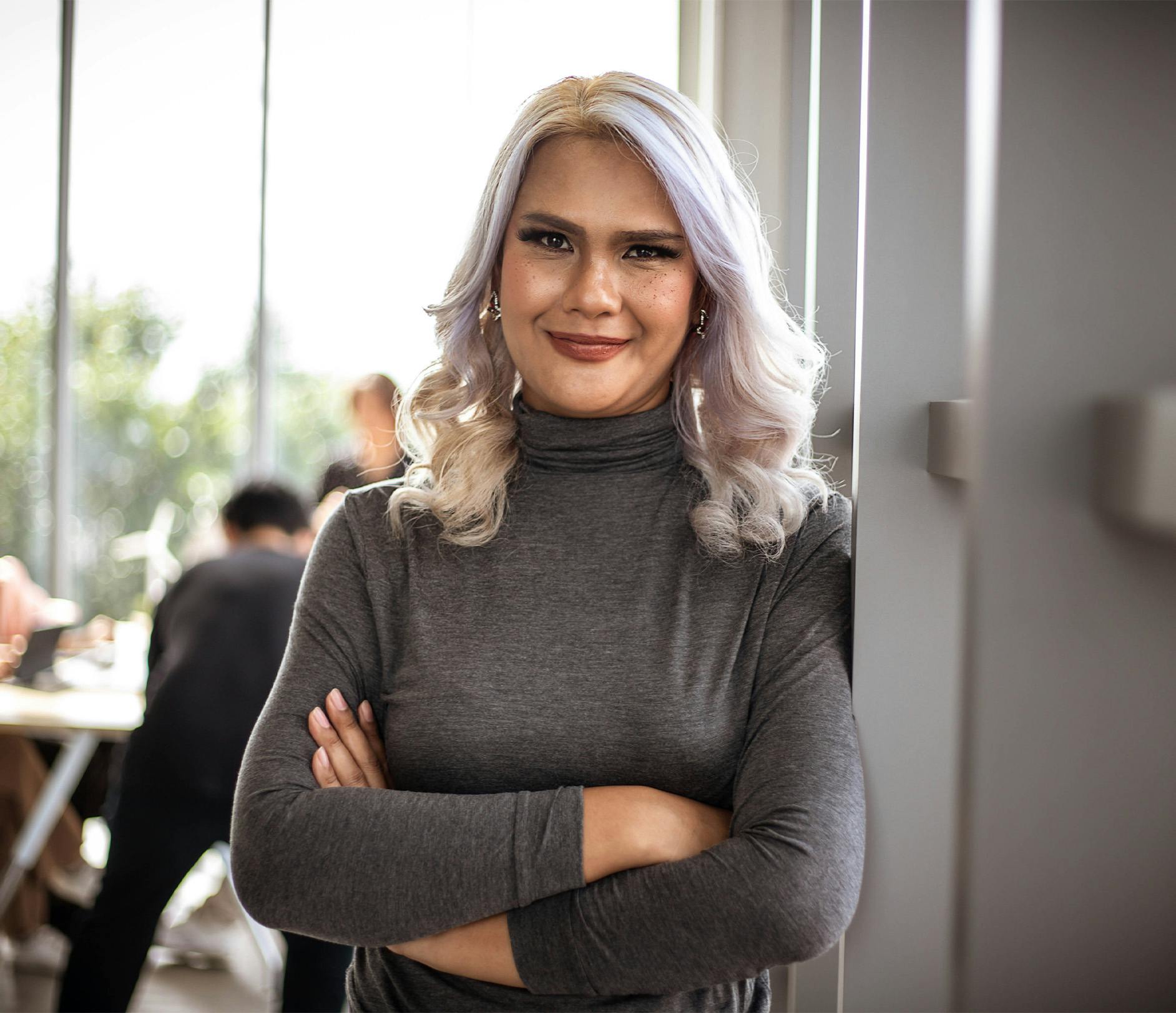 woman wearing a grey long sleeve shirt