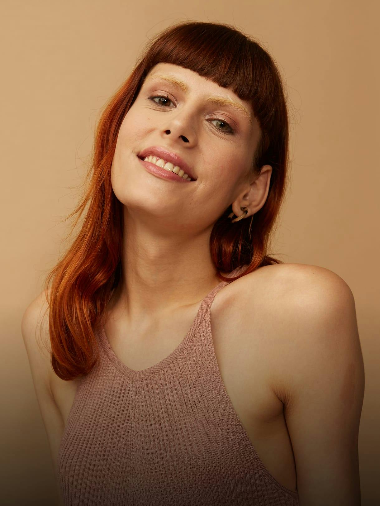androgynous person smiling