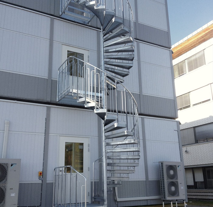 Spiral staircase with steps of grating and childproof railing