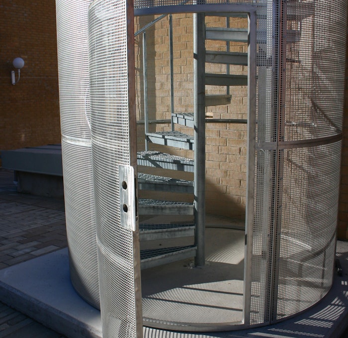 Spiral staircase with ground connected protective cage