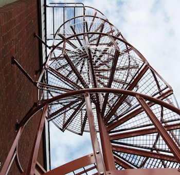 Powder coated outdoor spiral staircase with industrial railing