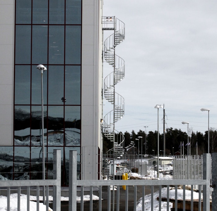 Evacuation spiral staircase with industrial railing