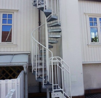 Slim powder coated spiral staircase outdoors