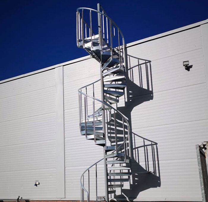 Spiral staircase outside with industrial railing