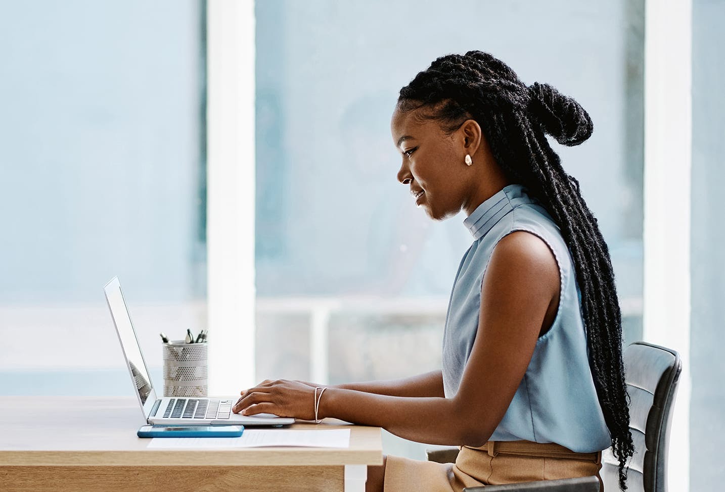 woman typing on a laptop