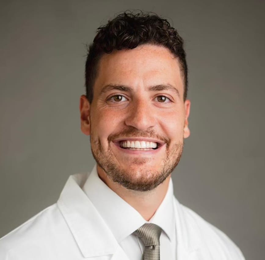 Dr Hadi Khazaal in white collar shirt and lab jacket