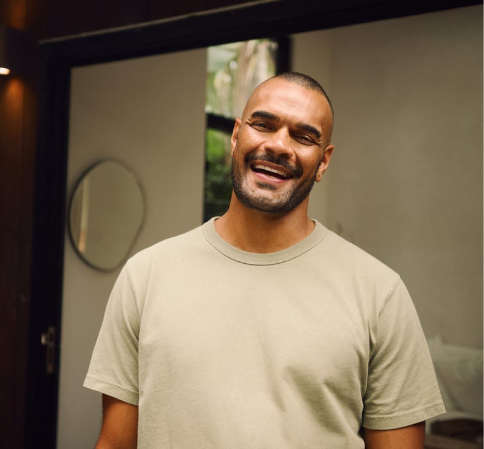 man in plain t-shirt smiling