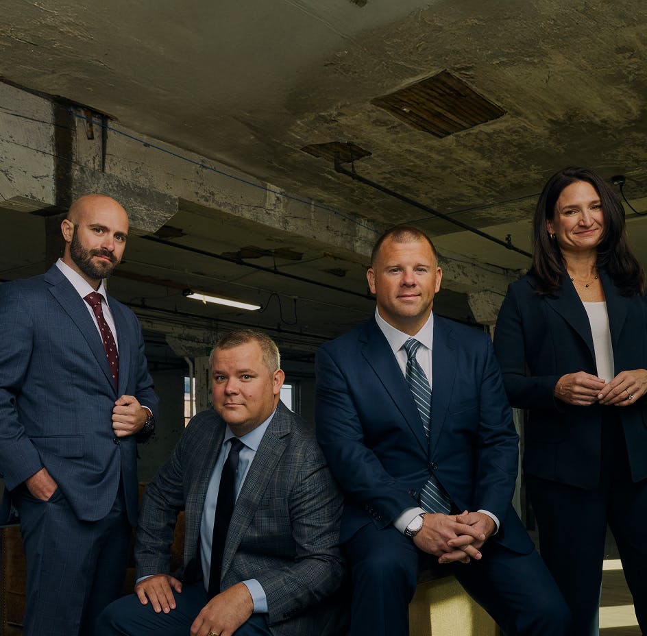 four attorneys standing