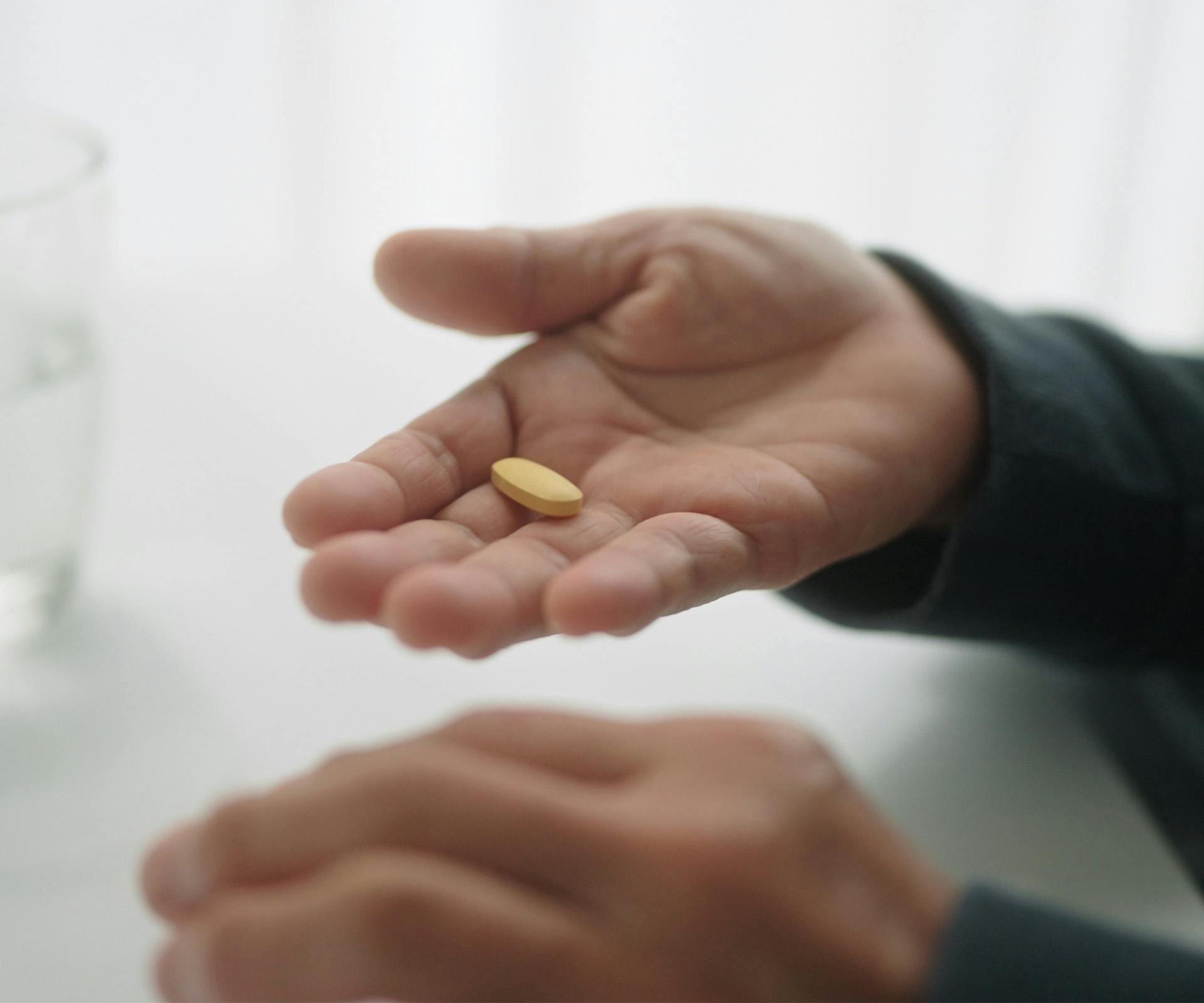 person holding medication