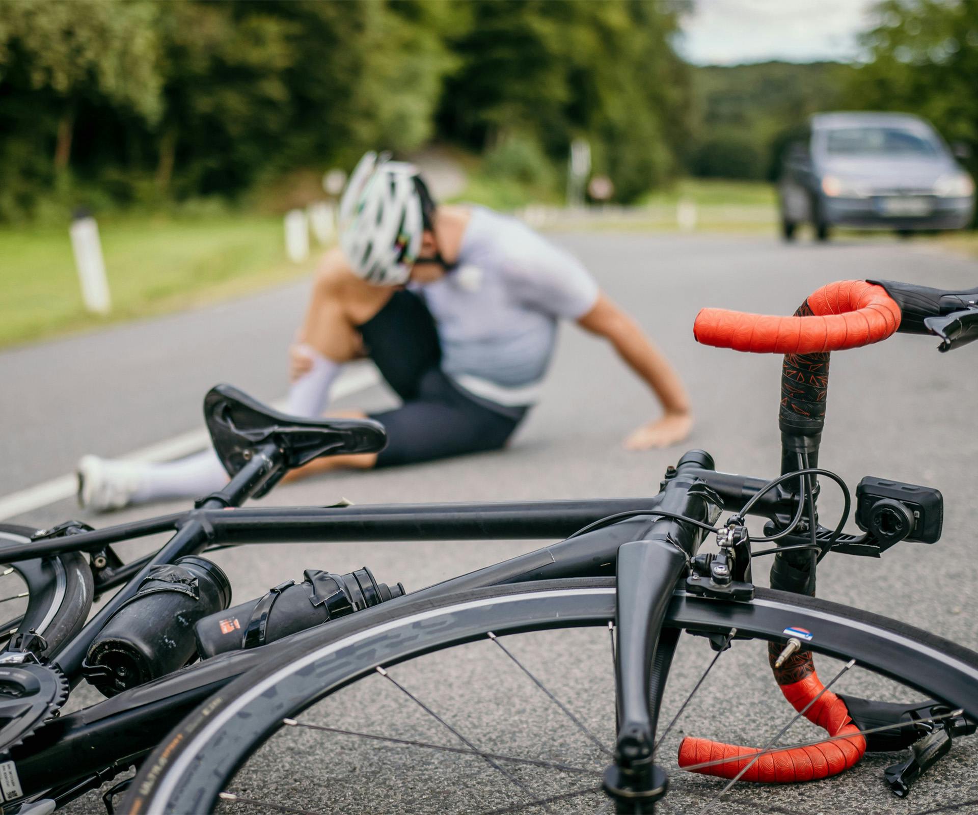 Cyclist on the road after bicycle accident