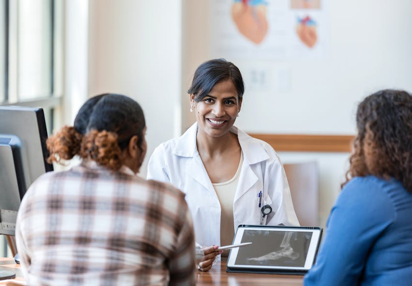 doctor speaking to patient
