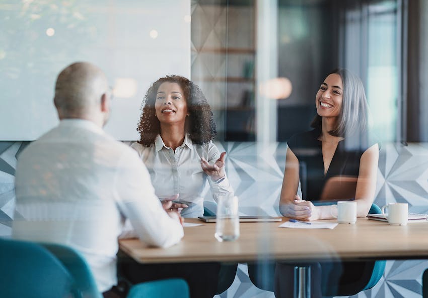 people speaking at a table