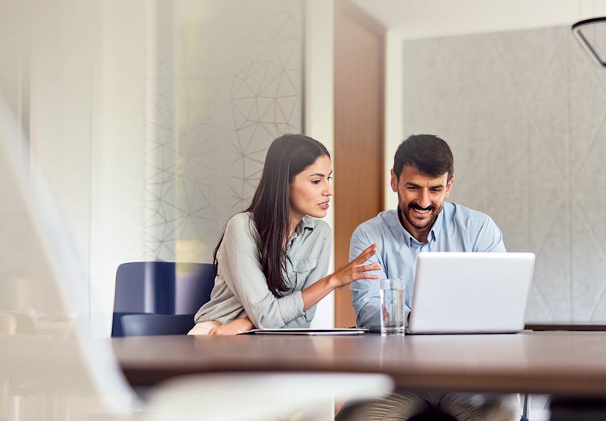 two people at laptop
