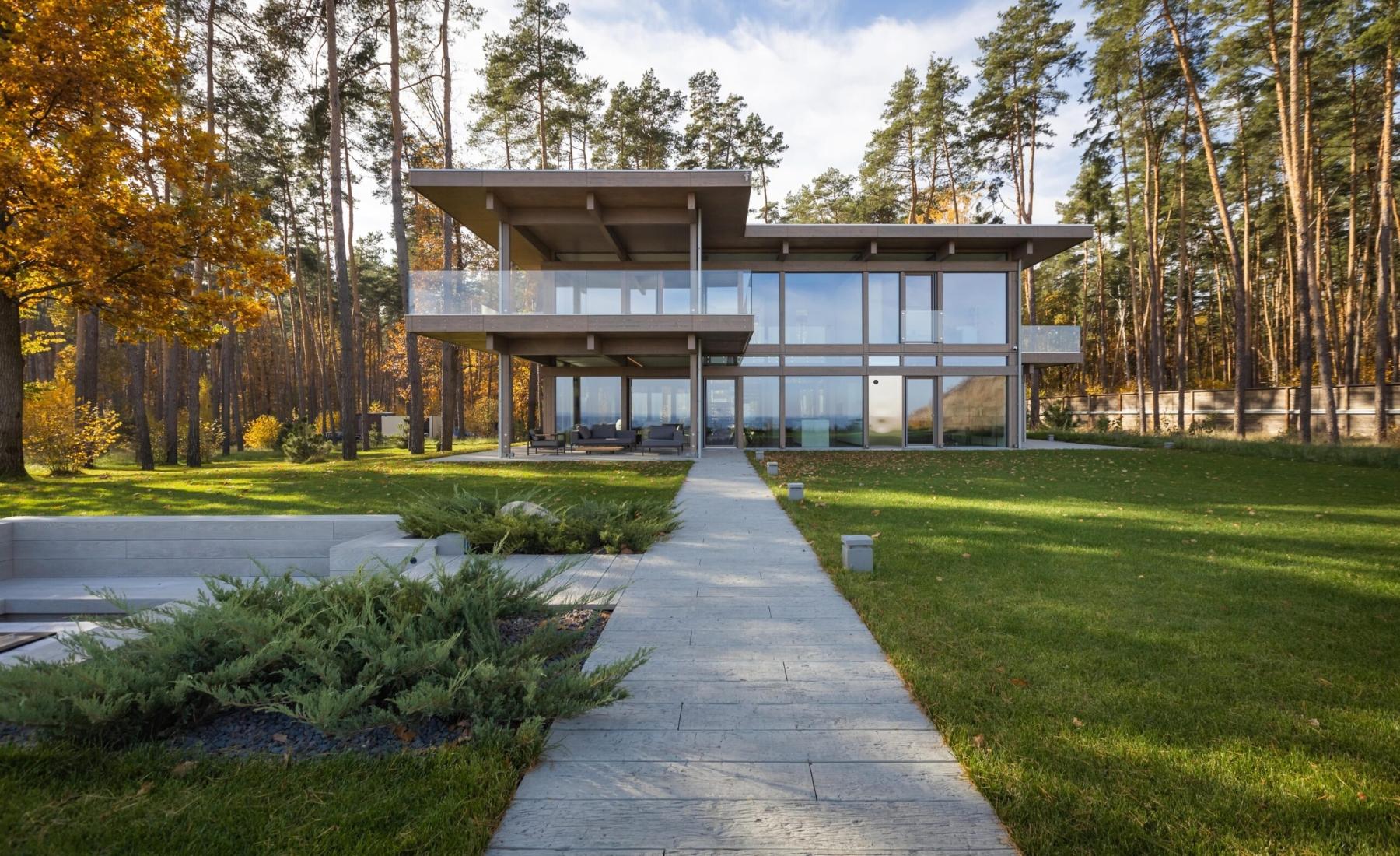 Timber and glass villa by the forest