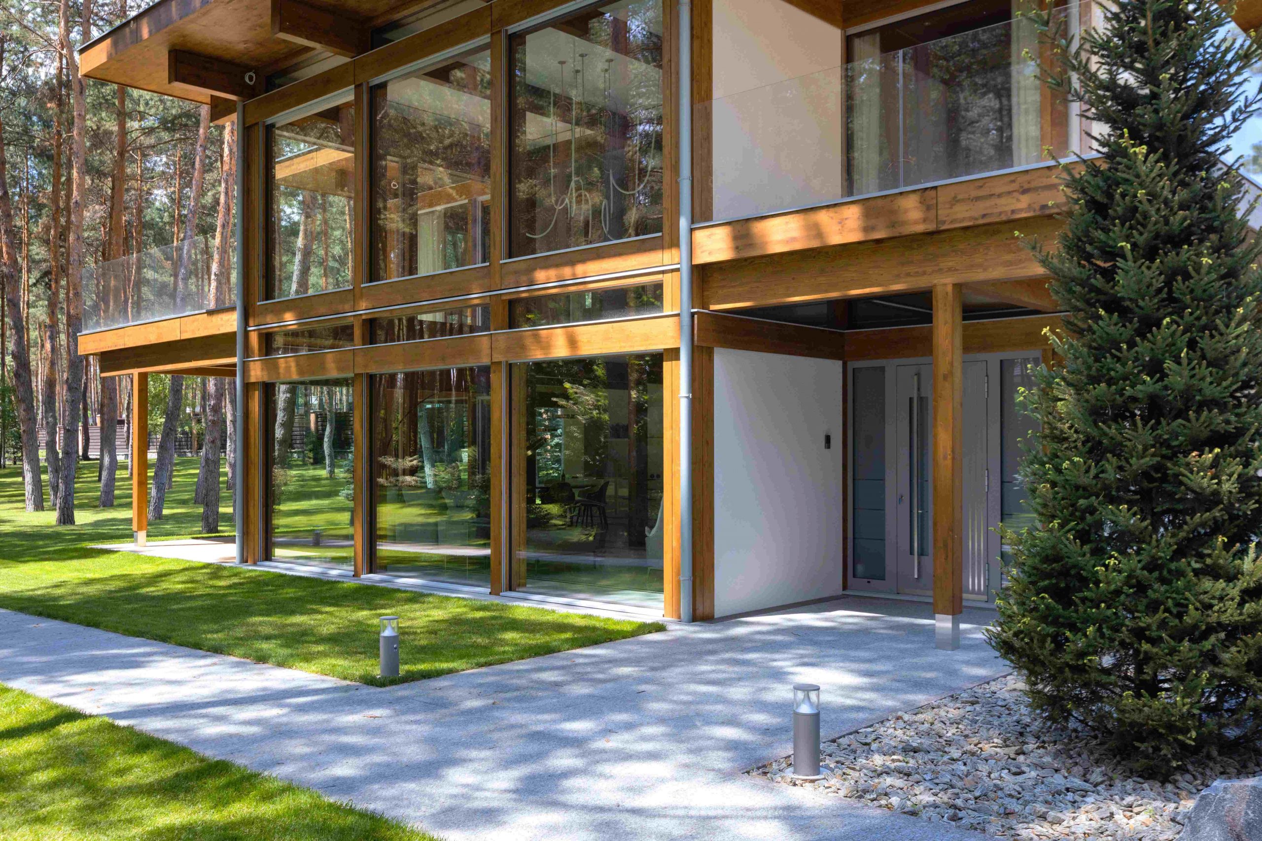 Timber-and-glass villa beside the forest