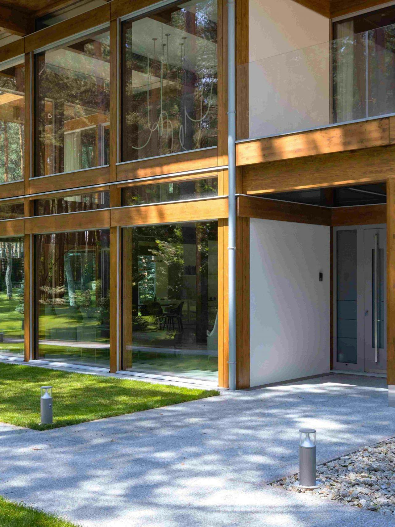 Timber-and-glass villa beside the forest
