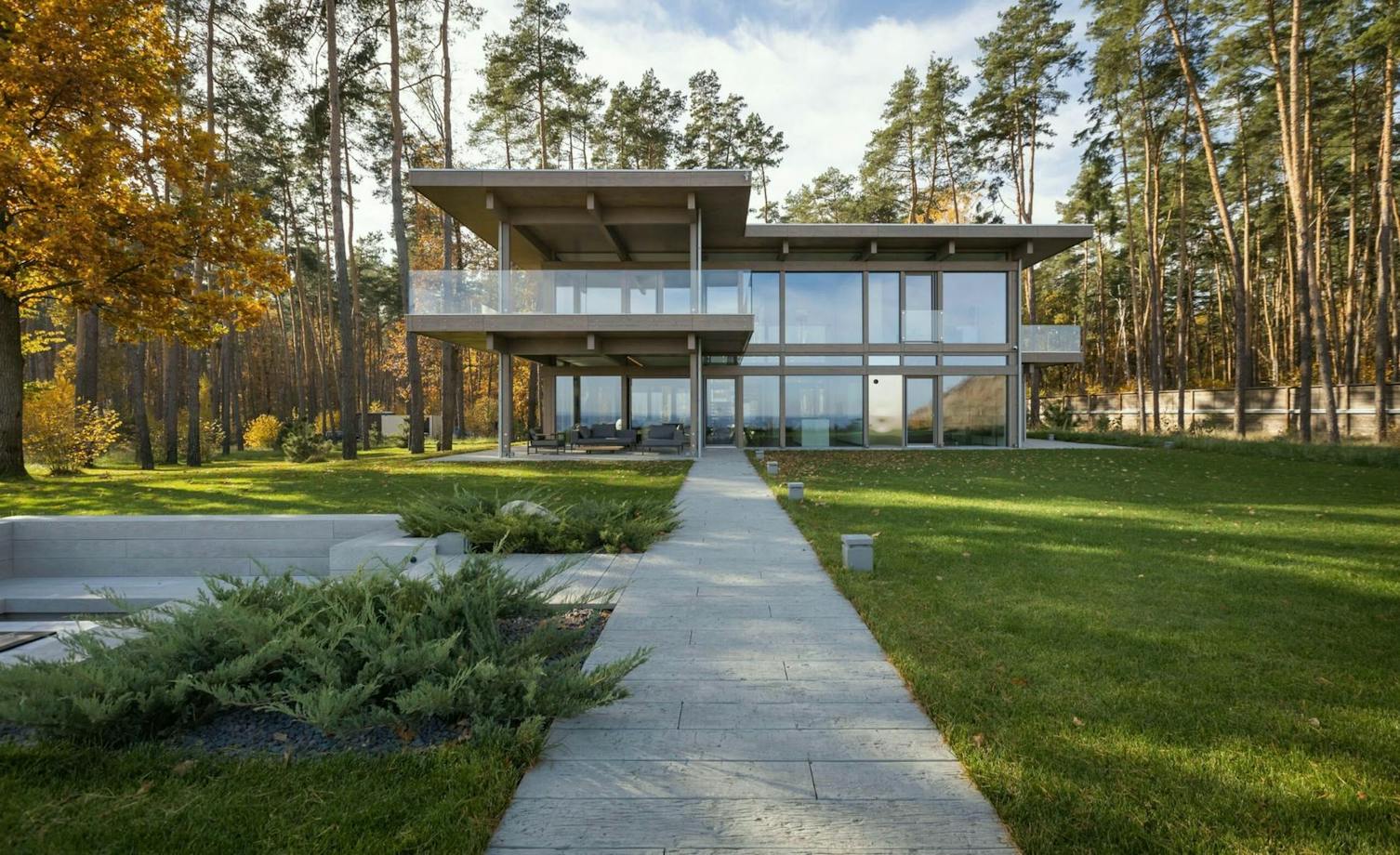 Timber-and-glass villa by the forest