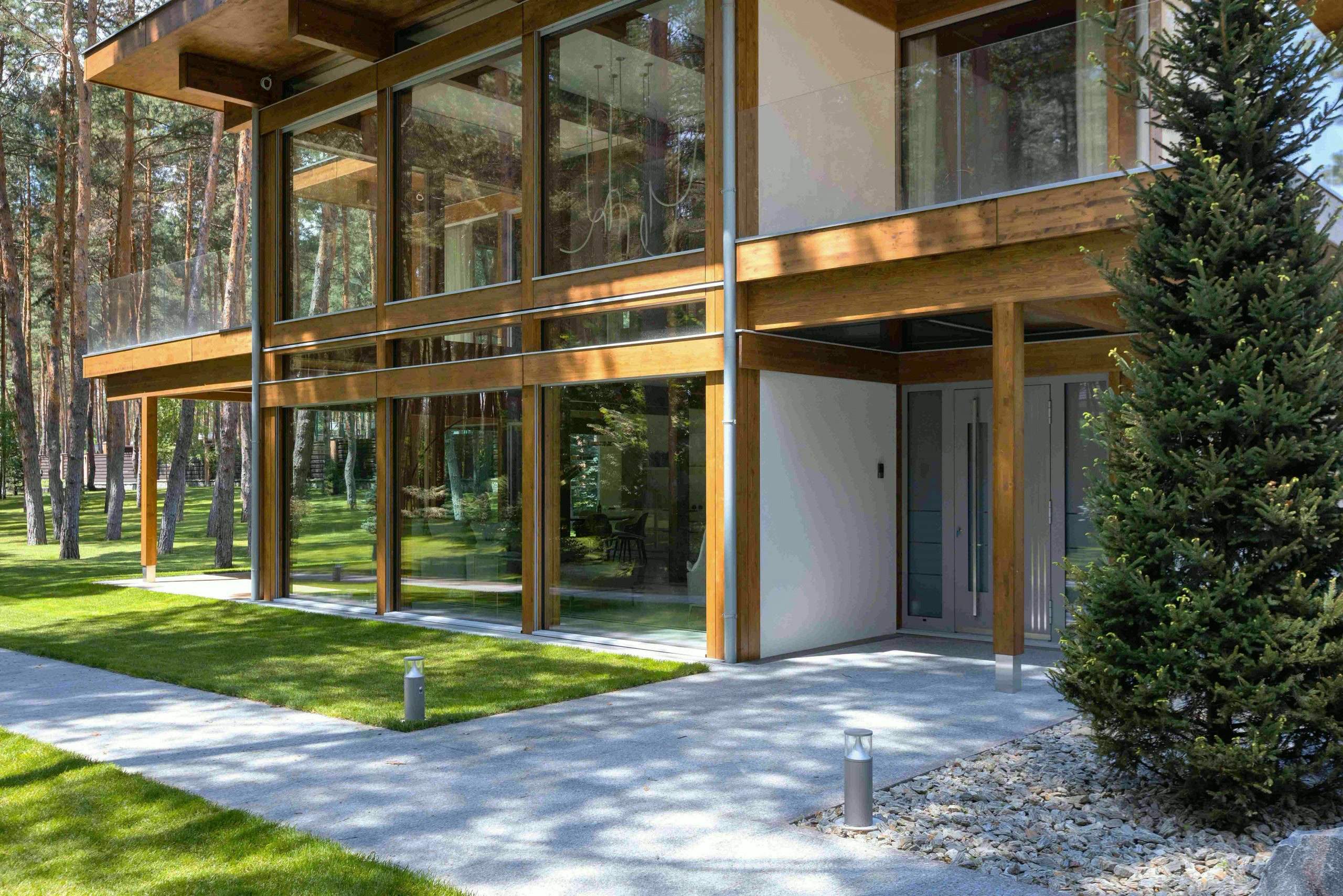 Timber-and-glass villa beside the forest