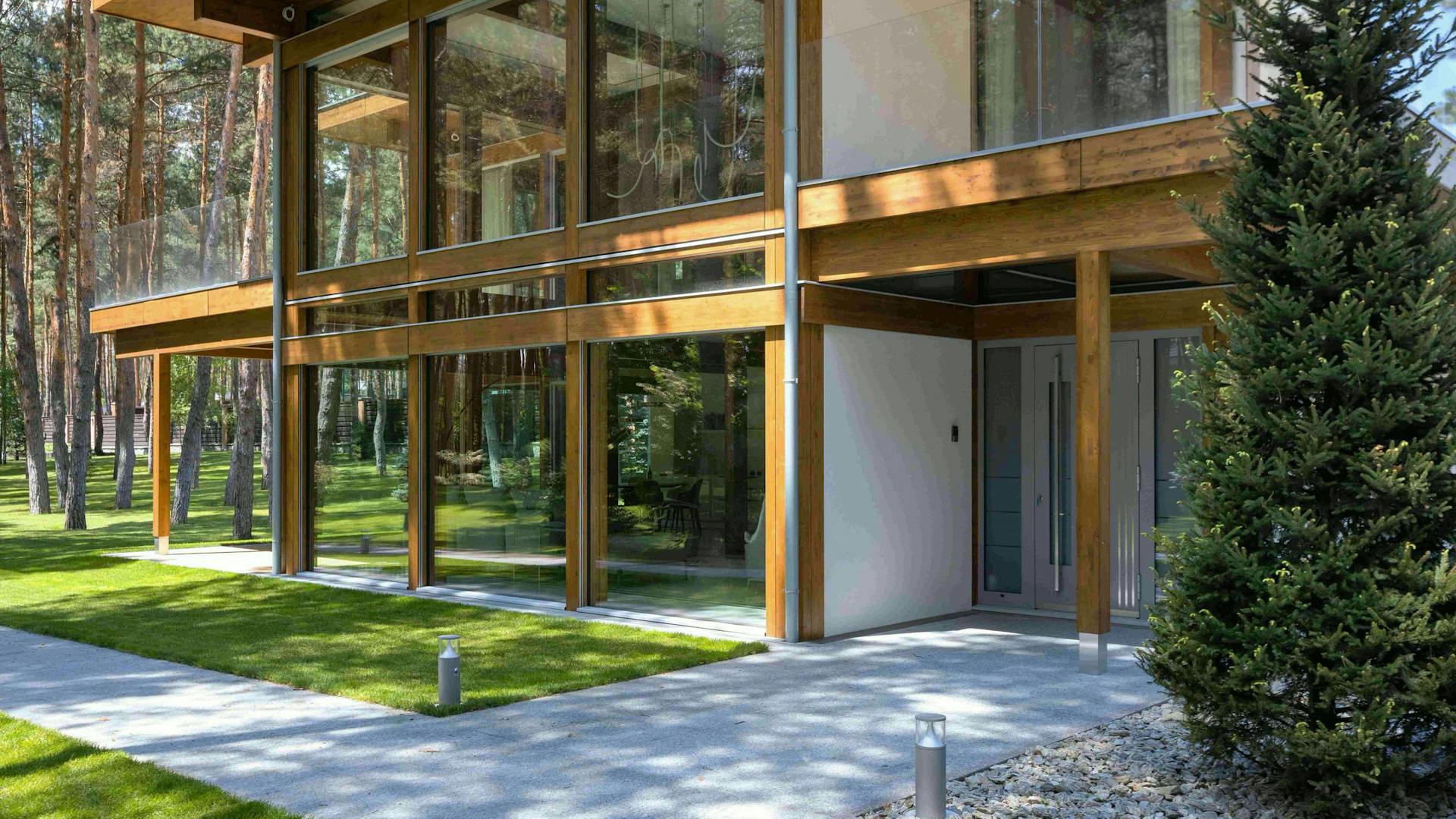 Timber-and-glass villa beside the forest