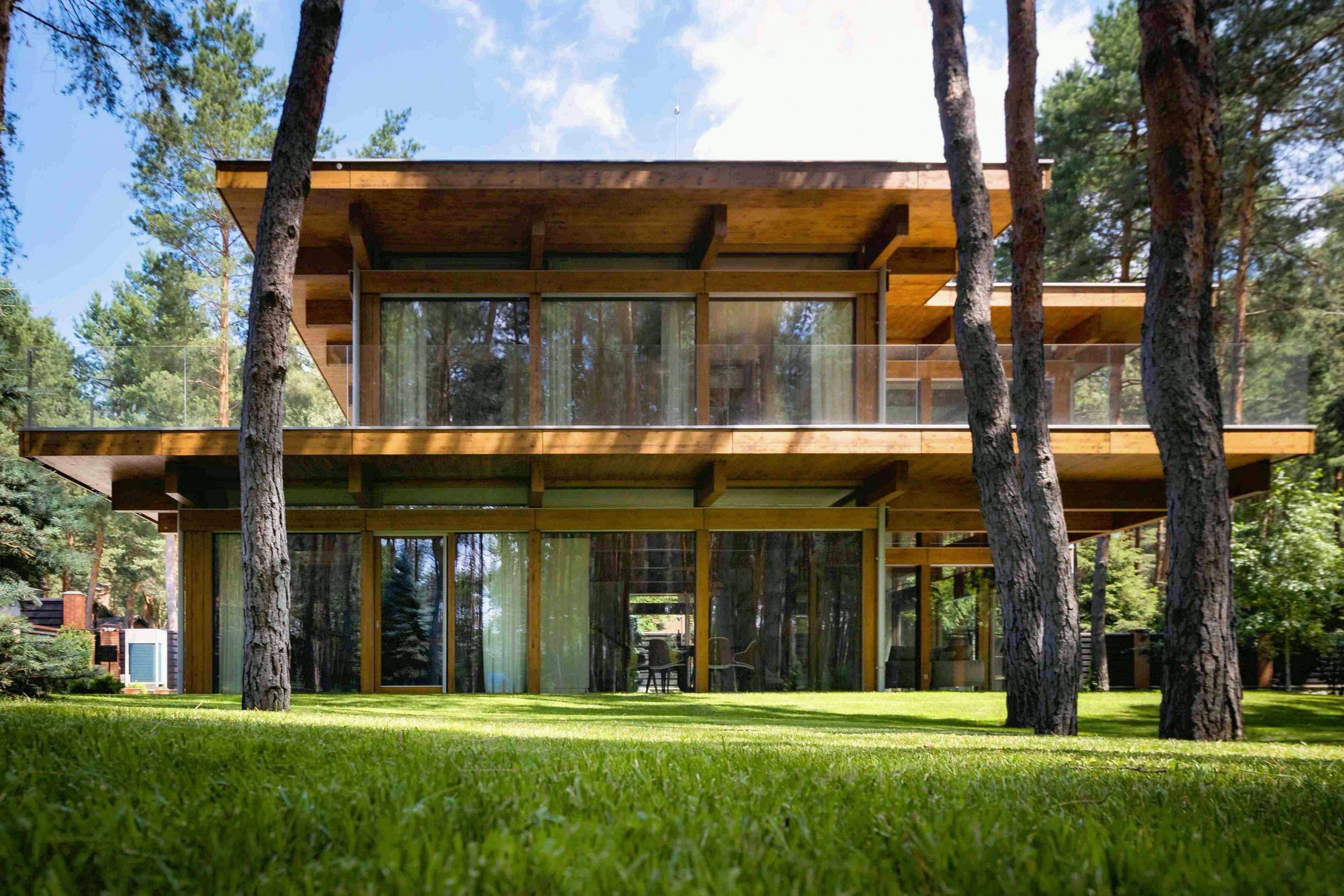 Timber-and-glass villa beside the forest