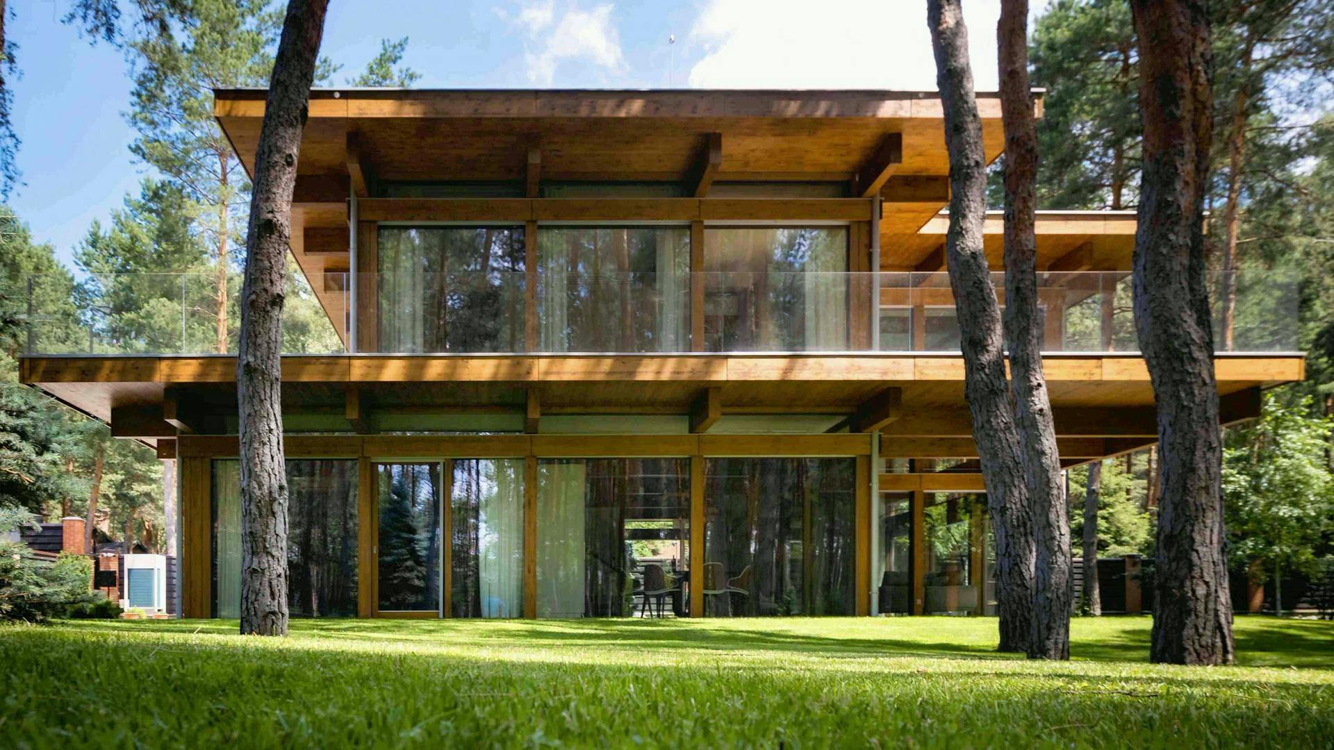Timber-and-glass villa beside the forest
