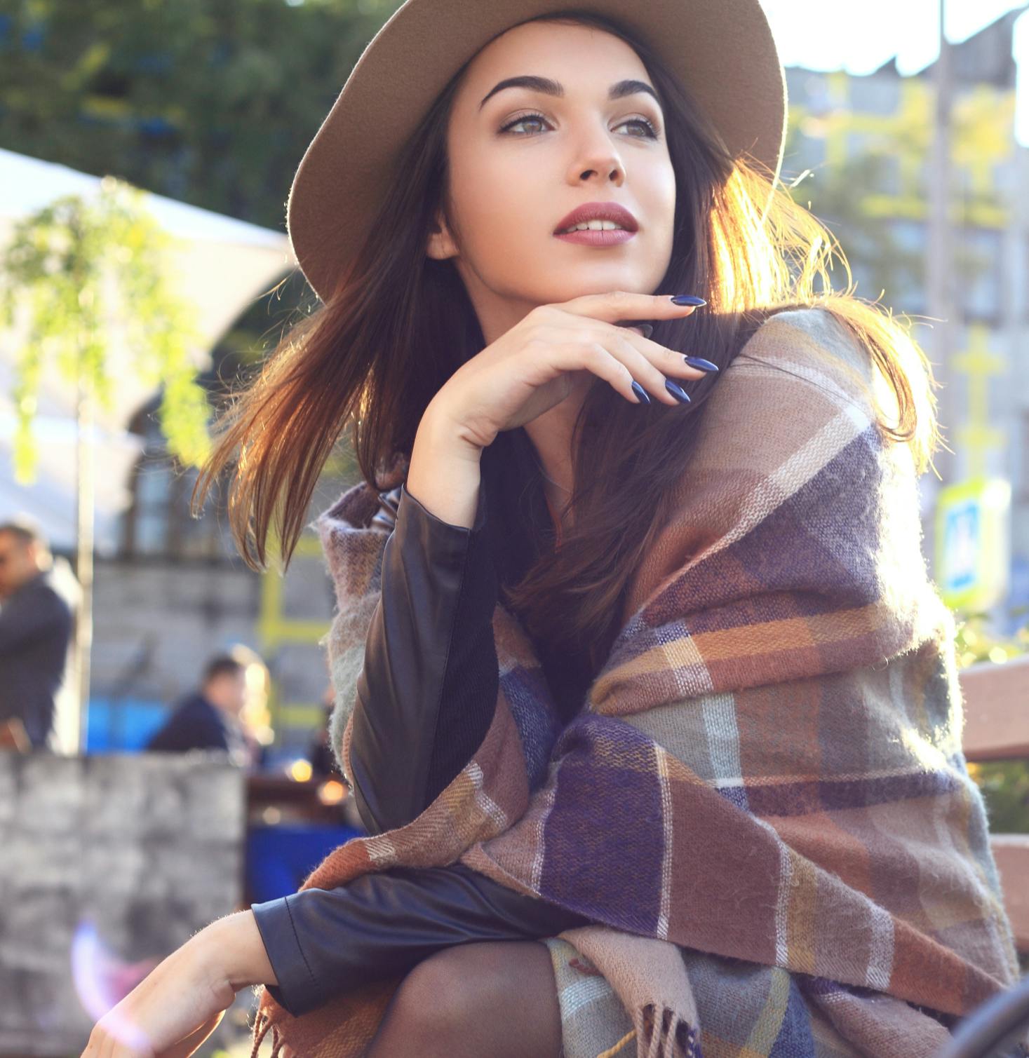 Lady sitting and looking off into the distance