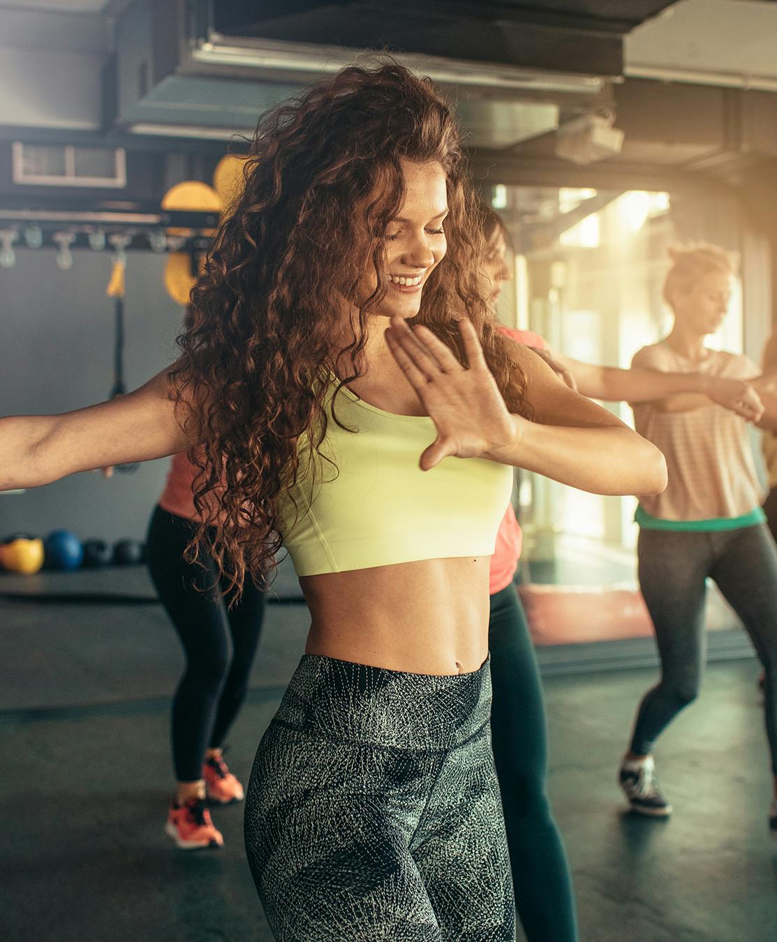 Woman in workout class that has slim waist
