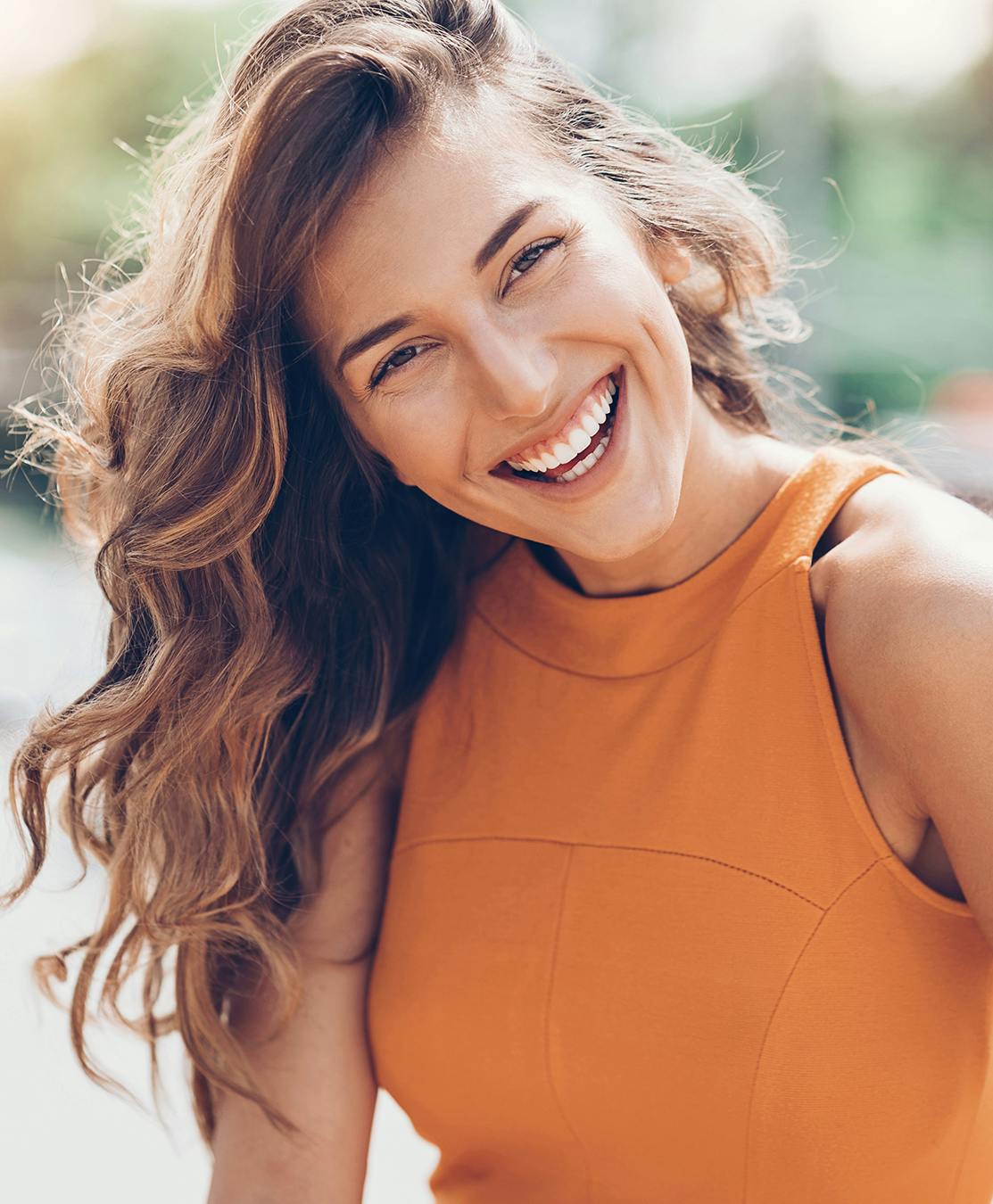 Younger lady smiling at camera