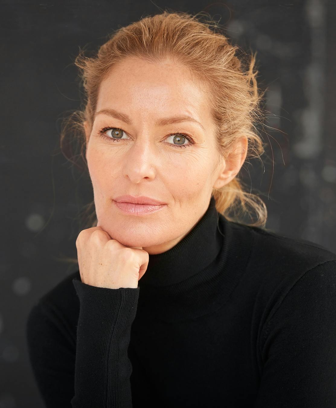 Older lady that has beautiful lifted eyebrows