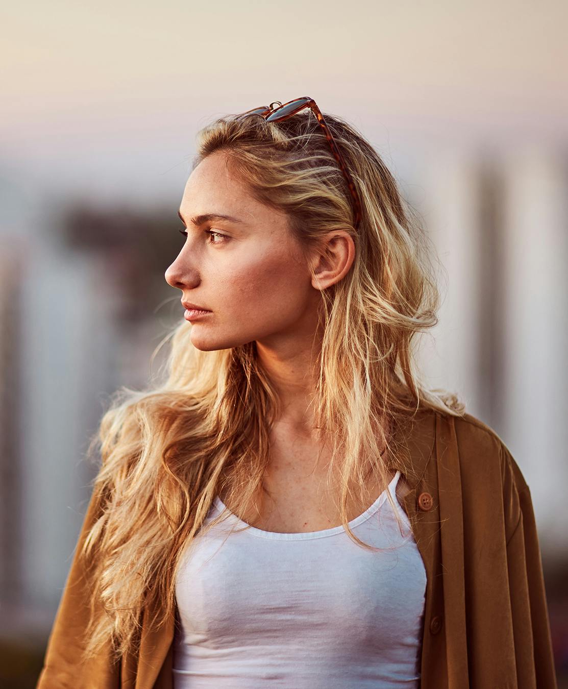 Lady with her hair put behind her ear