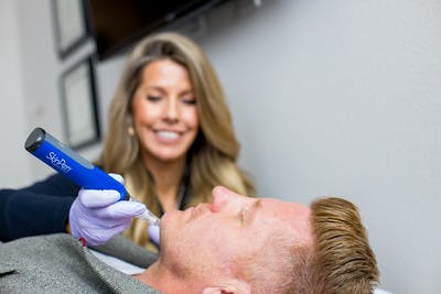 Provider performing SkinPen Microneedling on patient