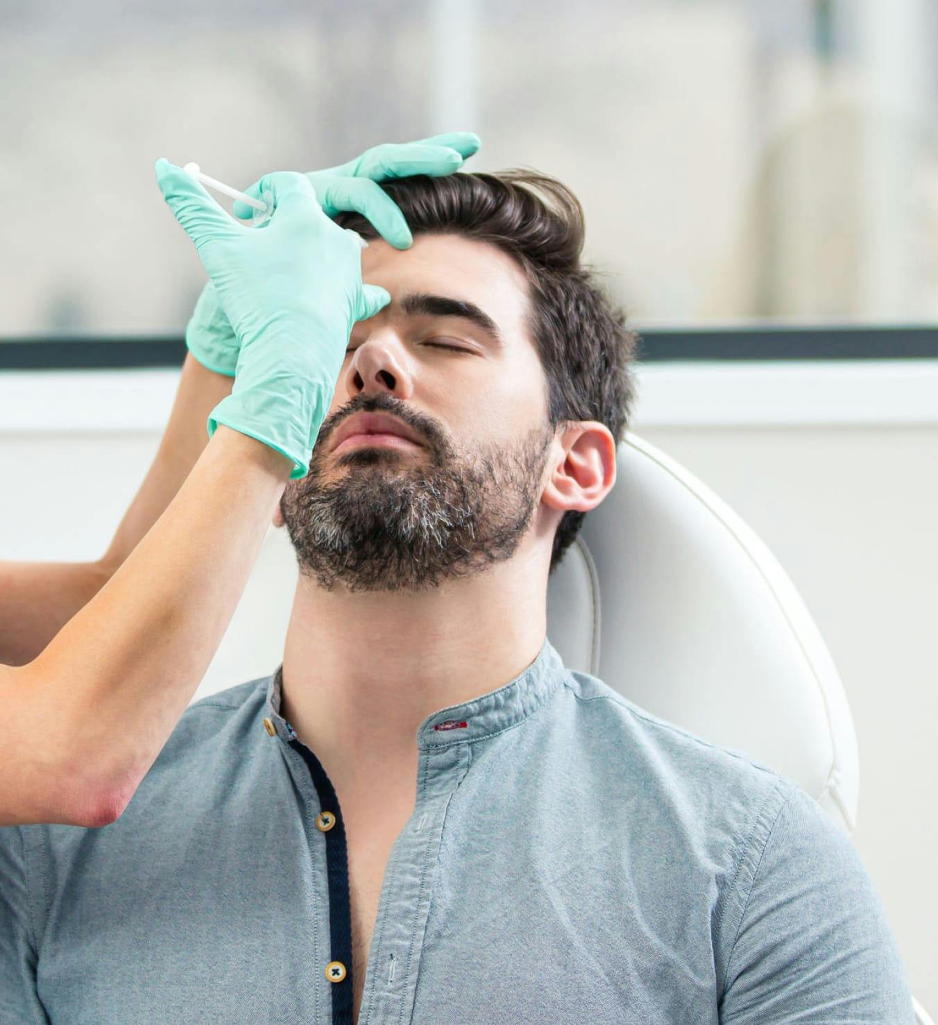 Man getting injection on the forehead