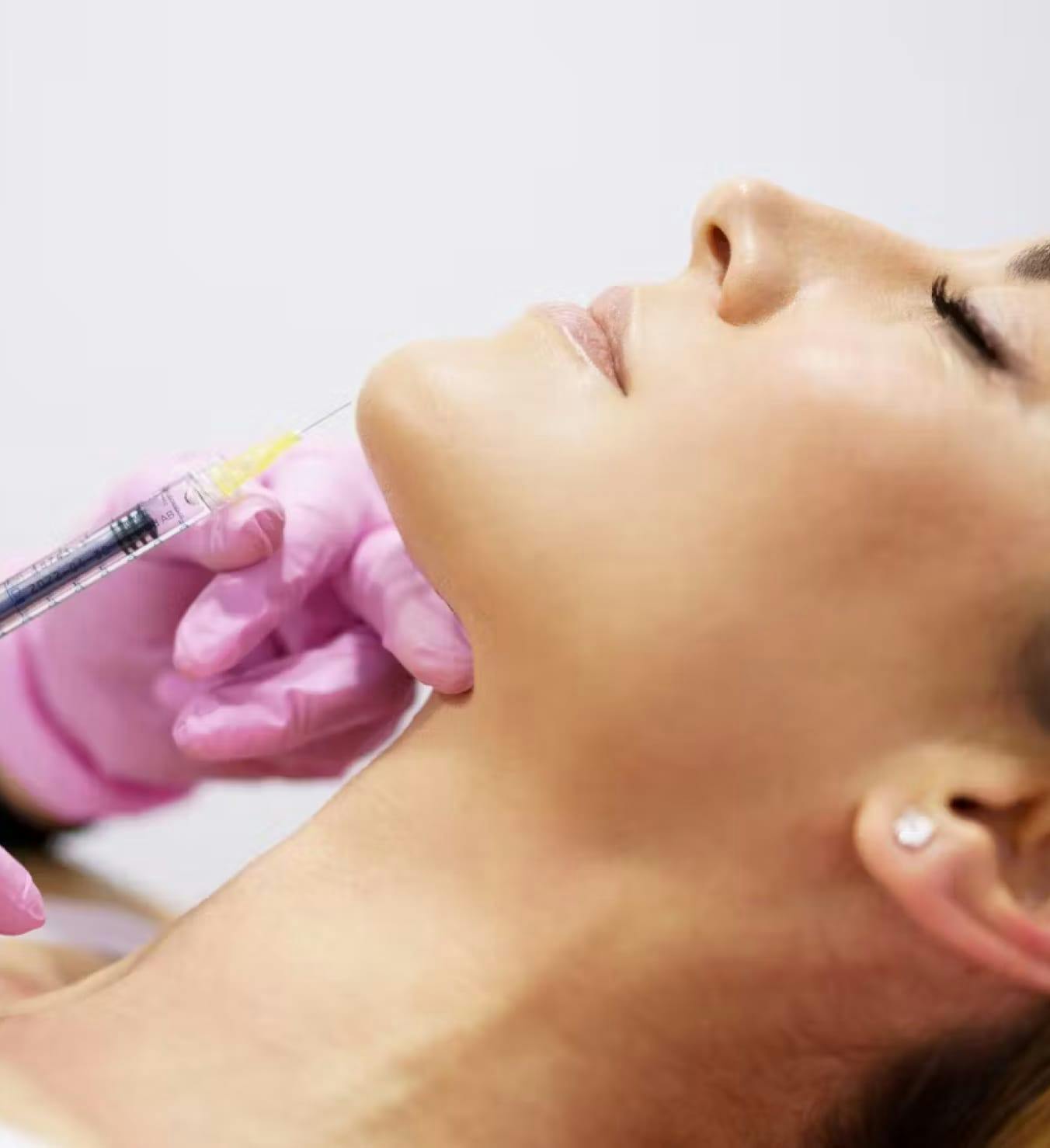 Woman getting injection in the chin