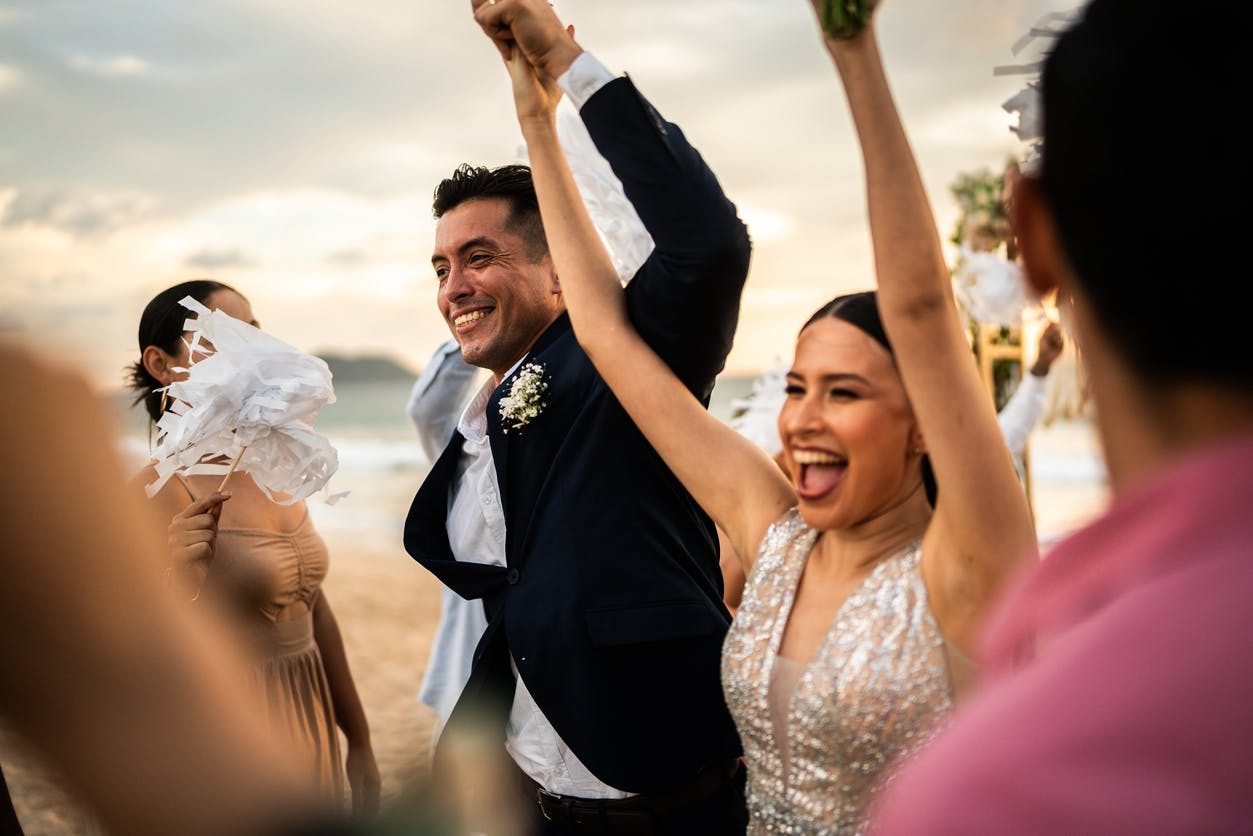 Bride and groom cheering