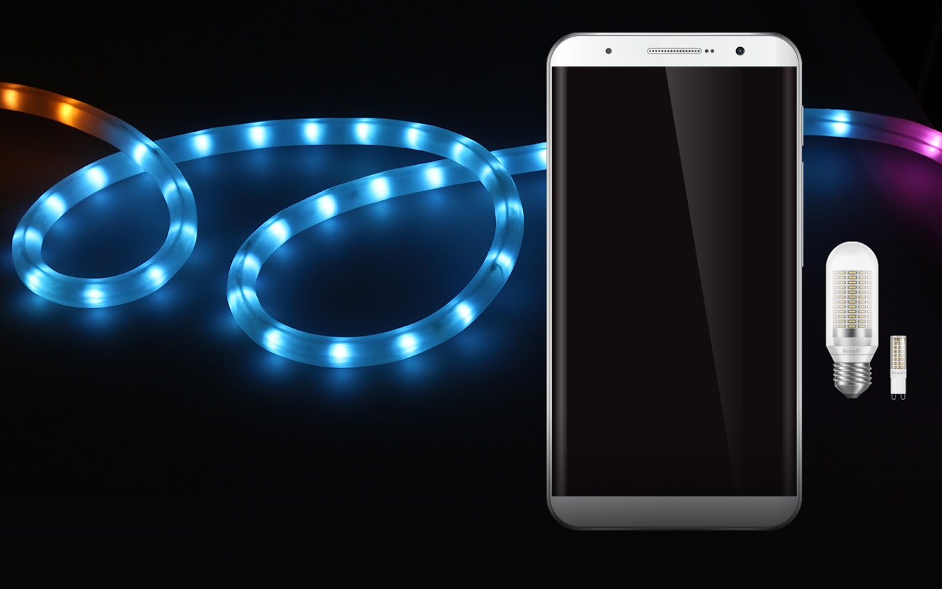 Vor einer leuchtenden LED Lichterkette liegt ein Handy und eine LED Glühbirne. In Technologiemetalle können Sie sicher und einfach, sparen, mit den Sparplänen von Golden Gates.