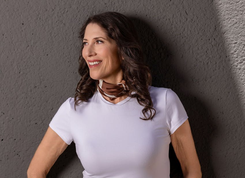 woman smiling and looking to the left