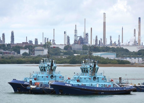 Solent Towage Ltd tugs "Apex" and "Phenix", with Fawley Refinery providing the background. (via Roger Marks, Flickr)