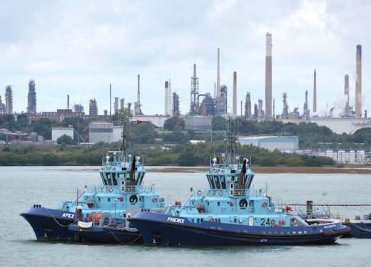 Solent Towage Ltd tugs "Apex" and "Phenix", with Fawley Refinery providing the background. (via Roger Marks, Flickr)