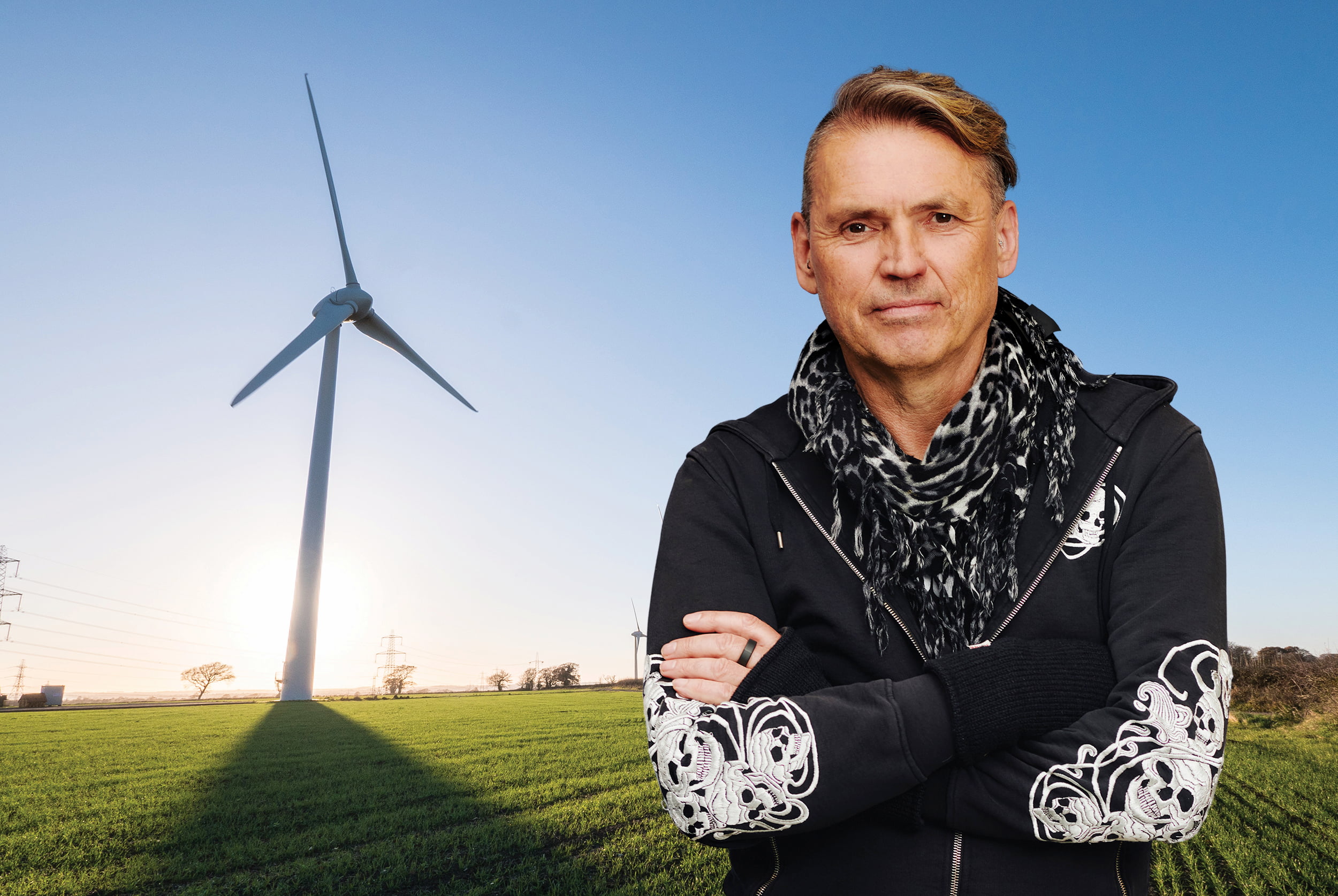 Dale Vince in front of a windmill