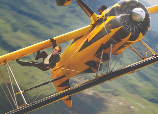 Kier Starmer as Tom Cruise hanging onto a biplane